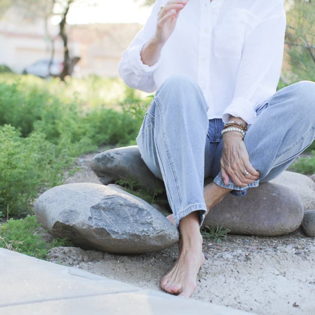 Belinda sitting on rocks